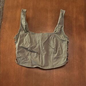 Rue21 teen green top with open braid on each side.  Fun for summer style